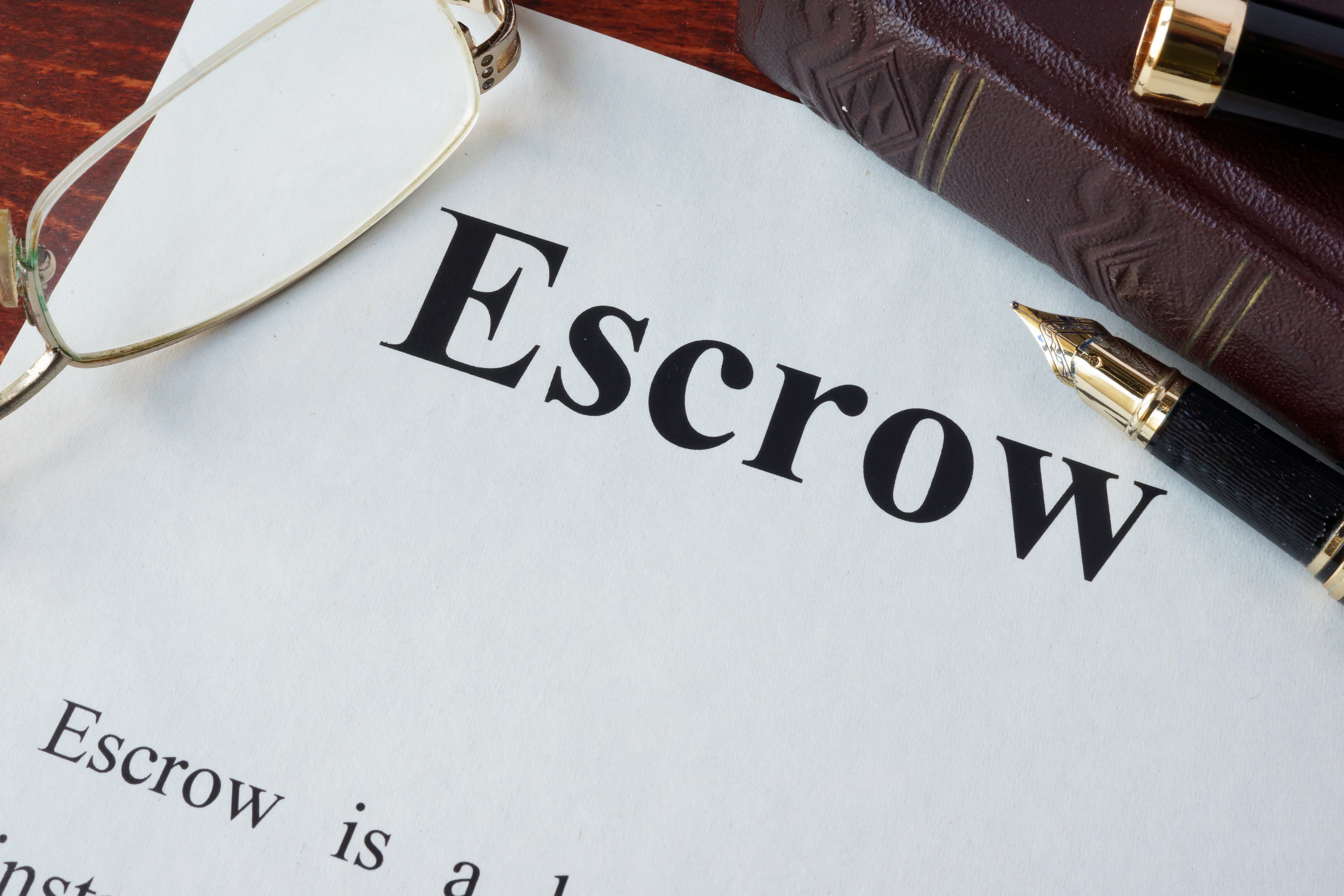 financial paper with the word escrow on it